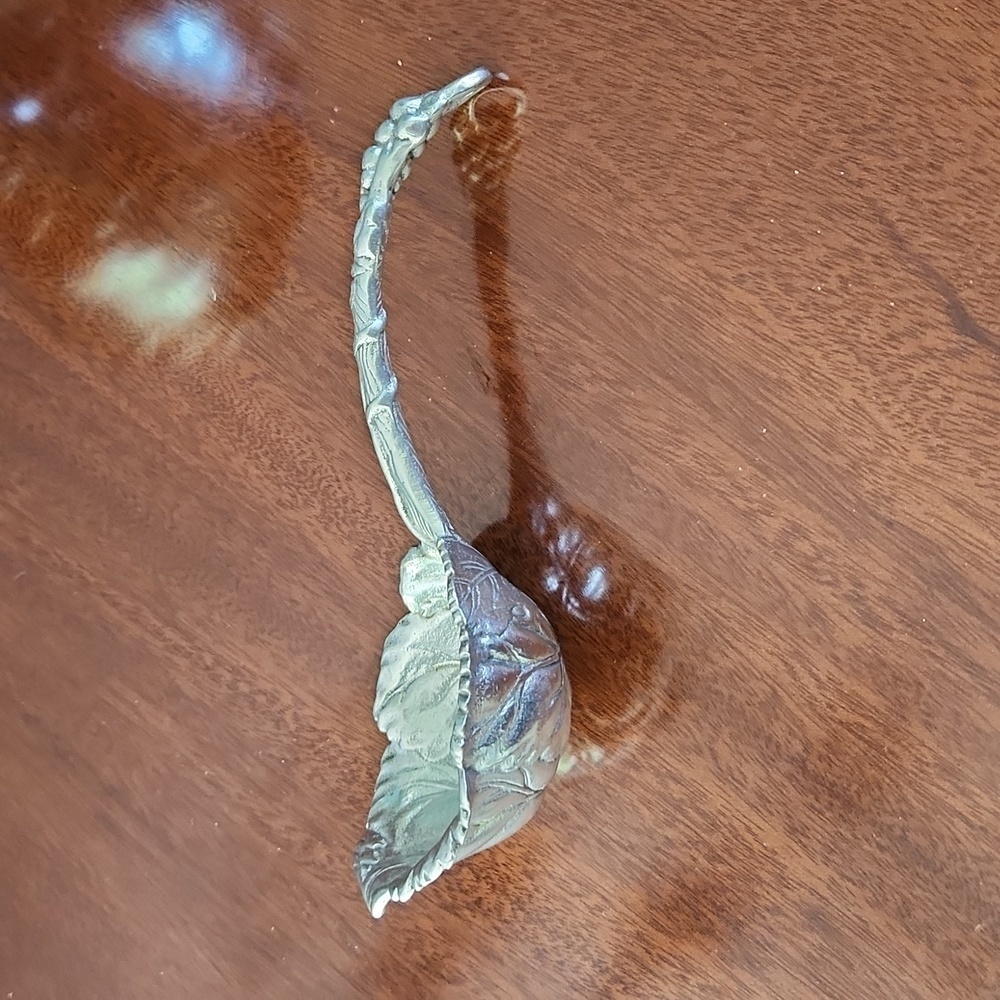 Arthur Court serving spoon in Grapevine pattern. Excellent condition.